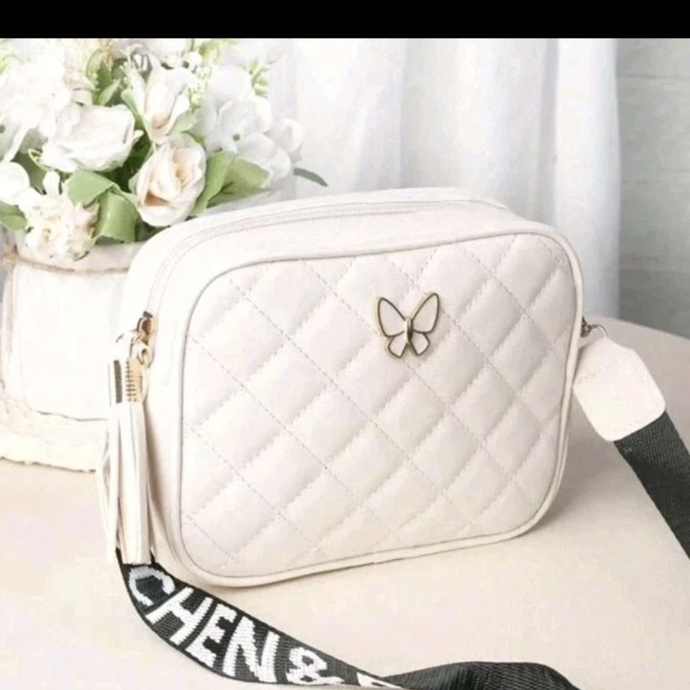 Elegant White Quilted Bag with Butterfly Accent